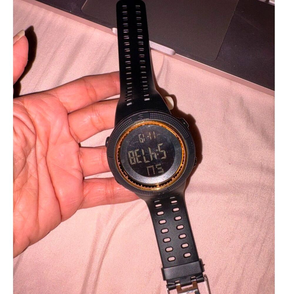 Black Digital Sport Watch with a gold-colored inner accent ring